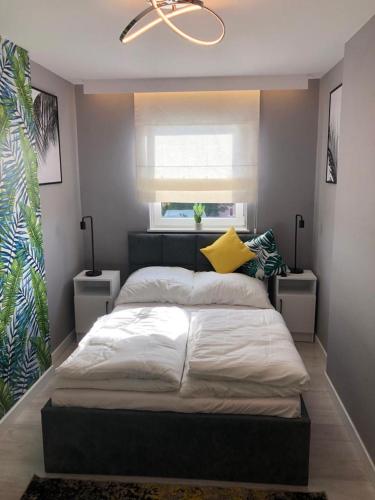 Posteľ alebo postele v izbe v ubytovaní Apartament Łeba Kosciuszki Centrum