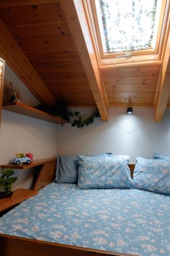 a bedroom with a large bed with a window at Old Town Boutique Apart Studio's - Rethymno in Rethymno