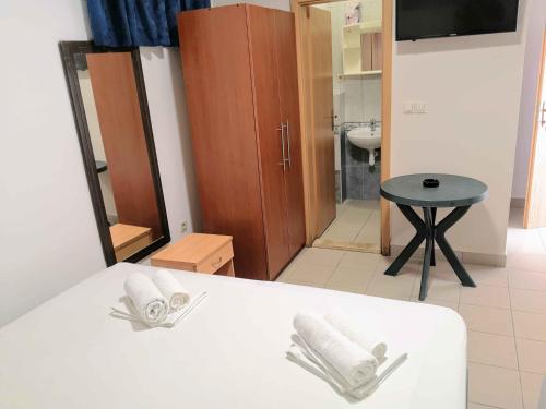 Postel nebo postele na pokoji v ubytování Guesthouse Villa Paškal
