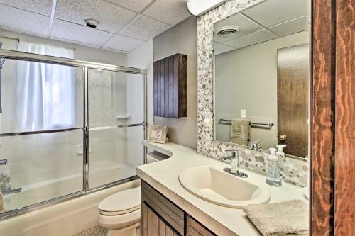 a bathroom with a sink and a toilet and a mirror at Family-Friendly Glen Home with White Mountain Views! in Glen