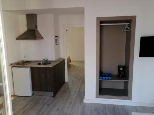 a kitchen with a sink and a counter top at Apartamentos Arcadio in El Arenal