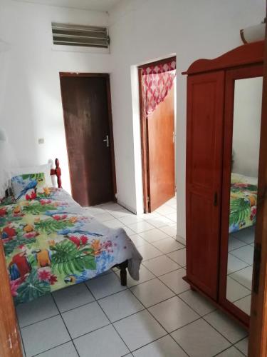 En eller flere senge i et værelse på Gite Belvédère Deshaies