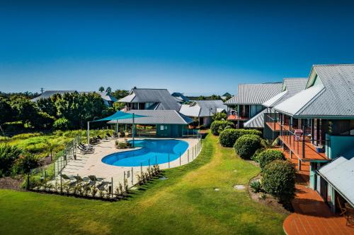 an aerial view of a house with a swimming pool at Riverside Holiday Resort Urunga in Urunga