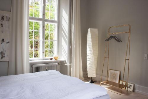 Tempat tidur dalam kamar di ApartmentInCopenhagen Apartment 1400