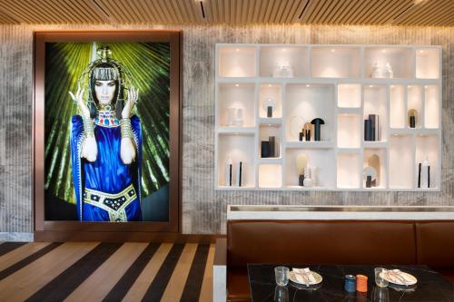 a restaurant with a picture of a woman on the wall at Mondrian Seoul Itaewon in Seoul