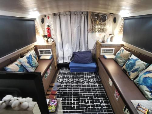 a small room with two beds in an rv at Sweet Elegant Boat Home @ Marina Waterfront in Singapore