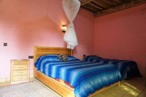 Postel nebo postele na pokoji v ubytování Paradise in the desert of Morocco