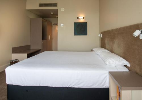 Кровать или кровати в номере Sudima Hotel Christchurch Airport