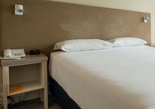 Кровать или кровати в номере Sudima Hotel Christchurch Airport