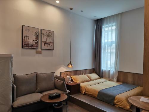 Postel nebo postele na pokoji v ubytování Shenzhen Ruiya Japanese-style Hotel Huaqiang North