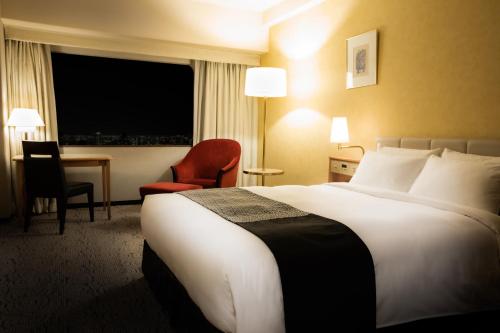 Postel nebo postele na pokoji v ubytování Hotel New Otani Hakata