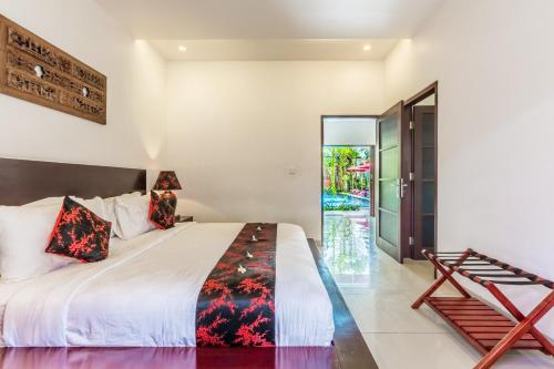 
A bed or beds in a room at Kamar Kamar Boutique Hotel
