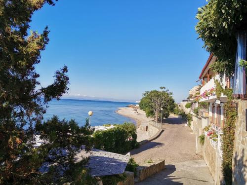 a view of the ocean from a street at Guest Rooms Melsambria in Nesebar