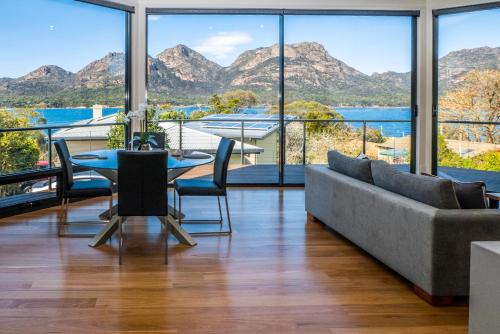 a living room with a couch and a table at At The Bay in Coles Bay