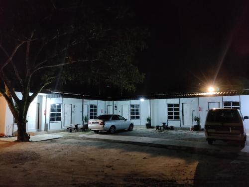 a car parked in front of a building at night at Aleesa Roomstay & Hotel in Pasir Puteh