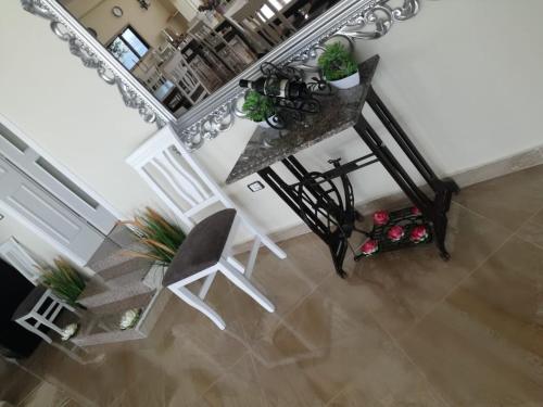 an overhead view of a room with a table and a chair at Hotel "SAN SAENA " in Vlorë