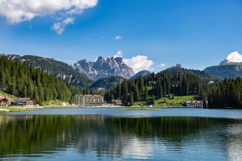 a view of a lake with mountains in the background at Grand Hotel Misurina in Misurina