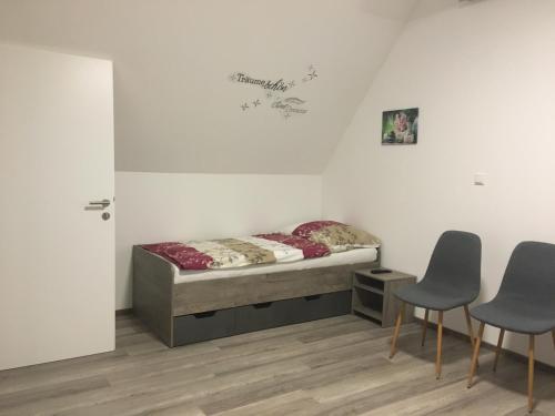Postel nebo postele na pokoji v ubytování Pension Seeblick Latzko