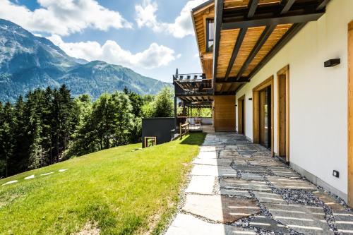 a house with a view of the mountains at Le Chalet Mont Blanc in Les Houches