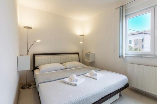 Postel nebo postele na pokoji v ubytování Apartment Dubravka near the sandy beach