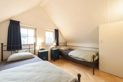 Postel nebo postele na pokoji v ubytování Vakantiehuis Villa 32