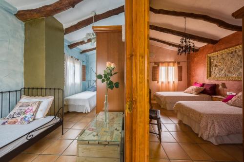 Postel nebo postele na pokoji v ubytování Casa rural lo Maset de Carmeta