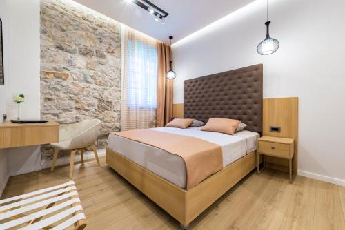 Postel nebo postele na pokoji v ubytování Casa Antika Suites