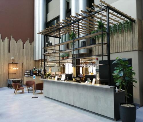 a lobby with a reception desk and a counter at Skyline Airport Hotel in Vantaa