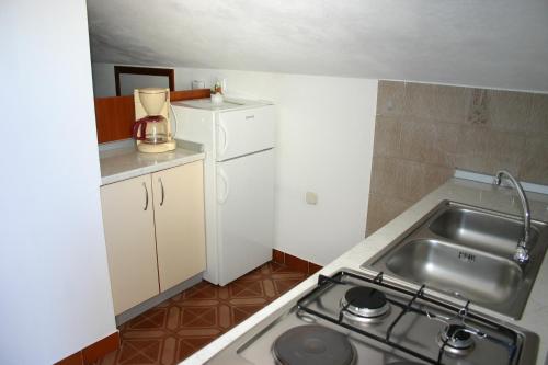 Majoituspaikan Apartments Grzunov keittiö tai keittotila