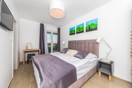 Postel nebo postele na pokoji v ubytování Villa Nia