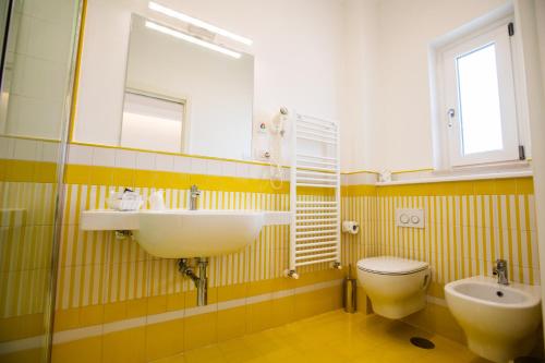 a bathroom with a sink and a toilet and a mirror at Hotel le Rocce - Agerola, Amalfi Coast in Agerola