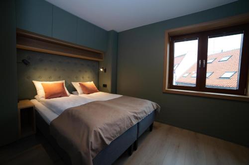 Letto o letti in una camera di Home Again Apartments Kirkegata