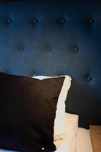 Letto o letti in una camera di Home Again Apartments Kirkegata