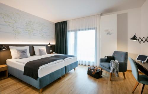 Кровать или кровати в номере JUFA Hotel Hamburg HafenCity