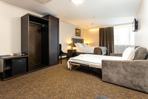Postel nebo postele na pokoji v ubytování Adoryal Hotell