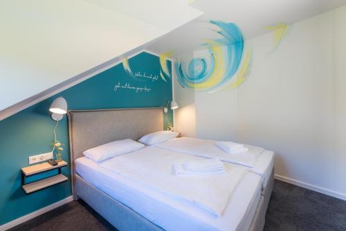 Postel nebo postele na pokoji v ubytování Hotel & Restaurant Mühlenglück