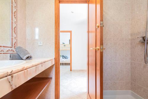 a bathroom with a shower and a sink at Myhost Augusta Altafulla in Altafulla
