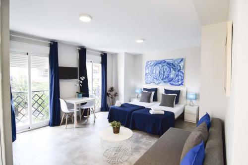 Posteľ alebo postele v izbe v ubytovaní Apartamentos CENTRO SALECIANOS