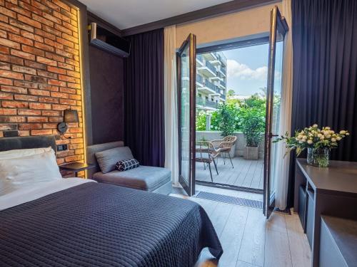 Ένα ή περισσότερα κρεβάτια σε δωμάτιο στο Loft House Premium Apartments