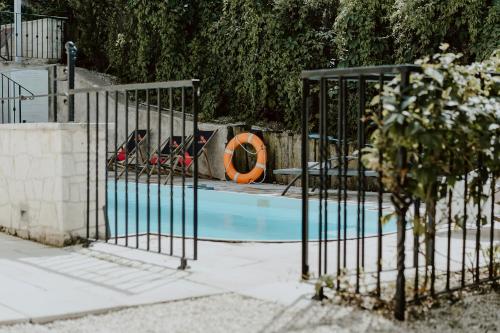 a swimming pool with a gate with shoes in it at Vincent in Kazimierz Dolny