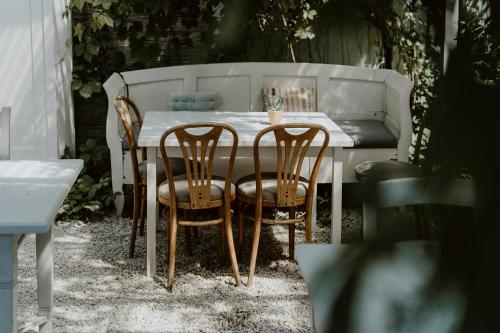 a table with two chairs and a table and a table and chairs at Vincent in Kazimierz Dolny