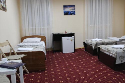 Кровать или кровати в номере Гостиница Паллада