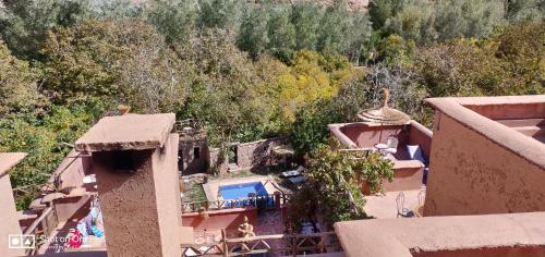 an aerial view of a resort with a swimming pool at Riad Des Vieilles Charrues in Boumalne