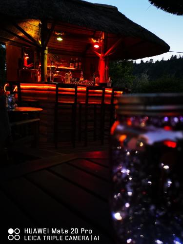 a drink jar in front of a bar at night at IRIS STUDIOS in Agios Nikitas