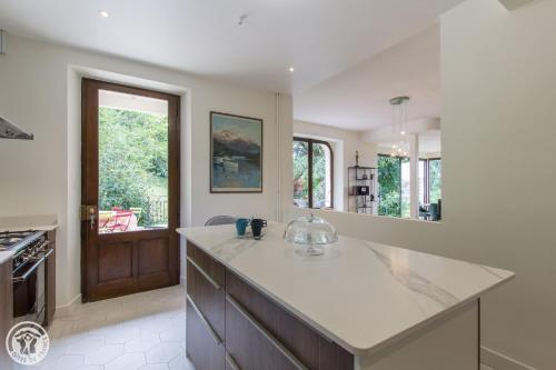 a kitchen with a counter top and a sink at VILLA SERANDITE maison de famille in Annecy