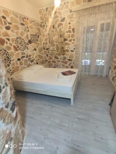Ένα ή περισσότερα κρεβάτια σε δωμάτιο στο Malvina Rooms