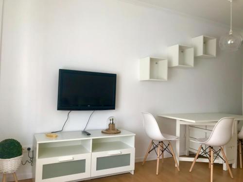 TV a/nebo společenská místnost v ubytování El apartamento de Andrea