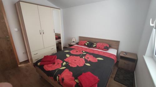 Postel nebo postele na pokoji v ubytování Apartmani Andrea