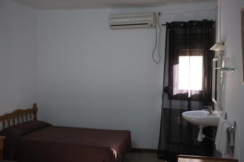 Postel nebo postele na pokoji v ubytování Hostal Europa