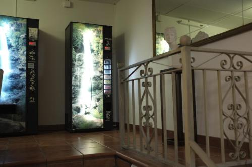 a staircase in a building with three pictures on the wall at Hostal Europa in Barcelona